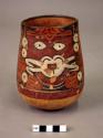 Cylinder vessel painted in polychrome with a masked "anthorpomorphic mythical being"