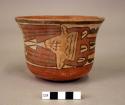 Bowl painted in polychrome with a trophy headed serpentine creature