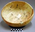 Ceramic bowl, brown on orange interior, basket impressed base, reconstructed