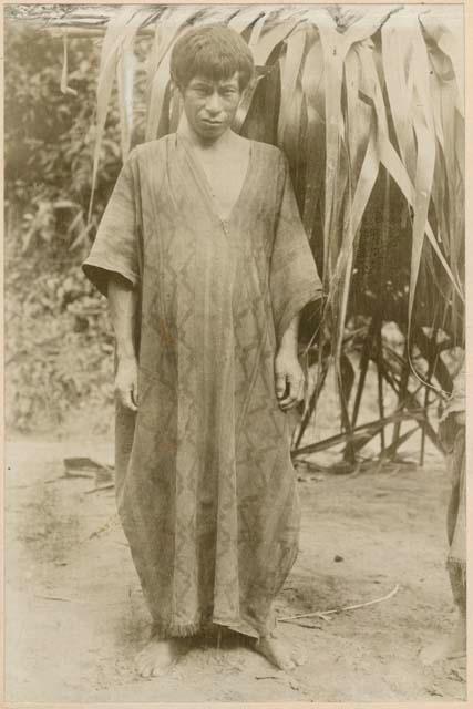 Man standing in front of structure