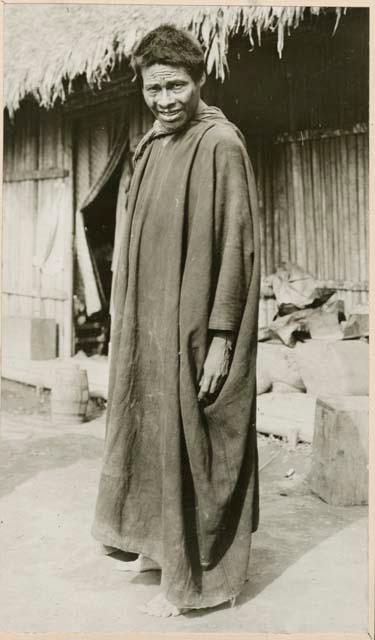 Man standing in front of structure