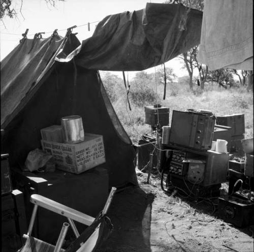 Sound equipment on the ground outside an expedition tent