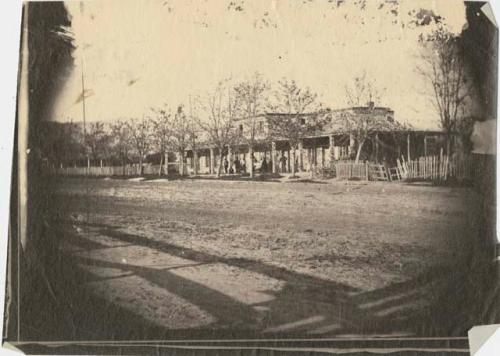 Building along a dirt road