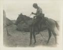 Man on horseback with supplies