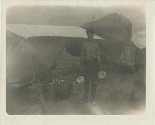 Man cooking at camp