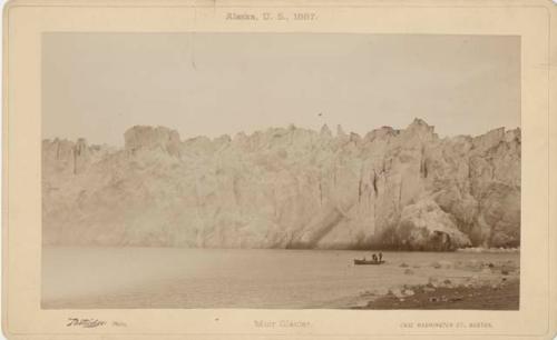 People canoeing, with Muir Glacier in background