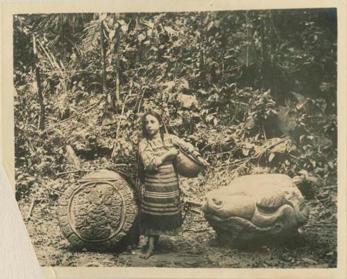 Girl standing between Altar L and Altar M