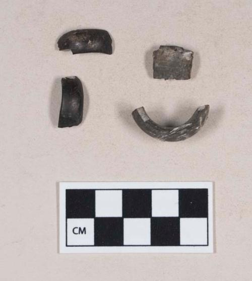 Worked shell fragments, curved, possible ring fragments, burned