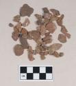 Earthenware sherds, some burnished; clay fragments; quartz flake; pebbles; burned animal bone fragment; calcined bone fragment