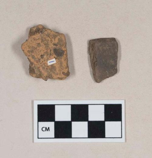 Coarse earthenware rim sherds, one undecorated, one impressed