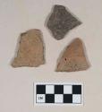 Coarse earthenware body sherds, two incised, one incised and rocker dentate