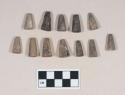 Conical ornaments, possibly beads or tinklers, made of worked animal bone, some burned or calcined