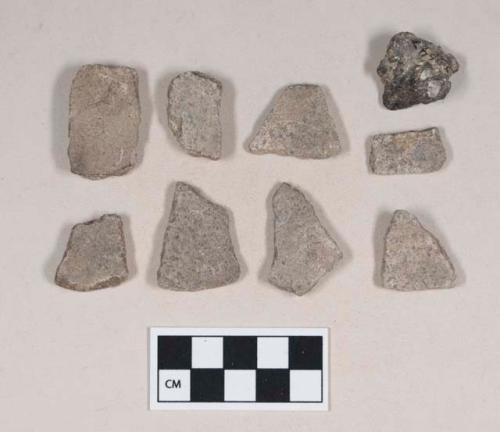 Soapstone vessel fragments; partially burned and melted coal fragment