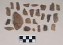 Earthenware sherds, some burnished, some figurine sherds; coarse earthenware body sherd, cord impressed