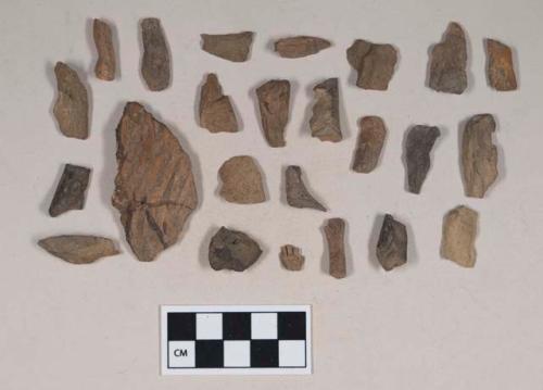 Earthenware sherds, some burnished, some figurine sherds; coarse earthenware body sherd, cord impressed