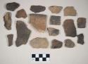 Coarse earthenware body and rim sherds, some undecorated, some incised