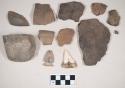 Coarse earthenware body and rim sherds, some undecorated, some cord impressed, one incised and punctate; ground stone, edged tools; chipped stone, projectile point, side-notched; perforated shark tooth