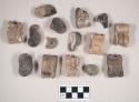 Animal bone fragments, mostly astralagus, some burned and calcined, some with cut marks, one with copper staining; coal fragment; unidentified material, possibly resin