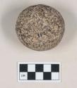 Ground stone, round stone object, abrasion at one end