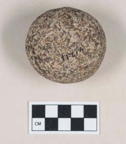 Ground stone, round stone object, abrasion at one end