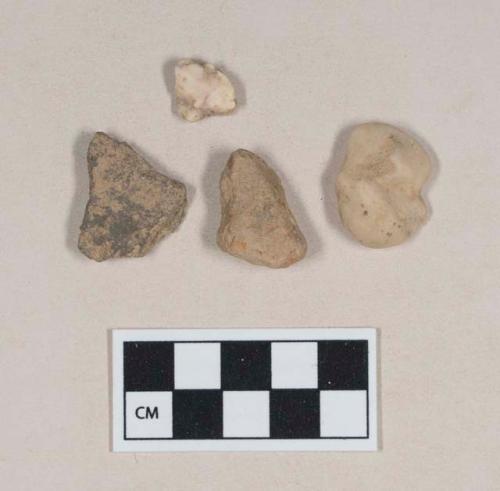 Coarse earthenware body sherd, undecorated; coarse red-bodied earthenware body sherd, undecorated; non-cultural stones