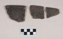 Ceramic, earthenware rim sherds, one undecorated, two cord-impressed, shell-tempered; two cord-impressed sherds crossmend