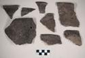 Ceramic, earthenware rim sherds, undecorated, shell-tempered; one sherd has one perforated hole; some with flared rims