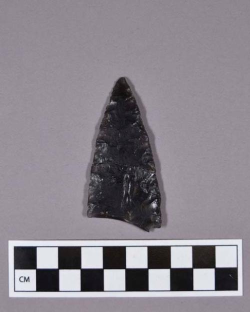 Obsidian projectile point, broken base, mended tip