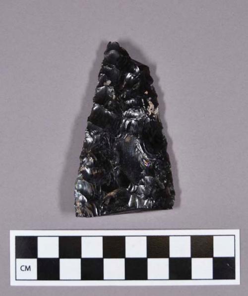 Obsidian projectile point, broken