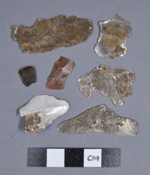 Mica, one shell fragment, one flake, charcoal fragments, and one bone fragment