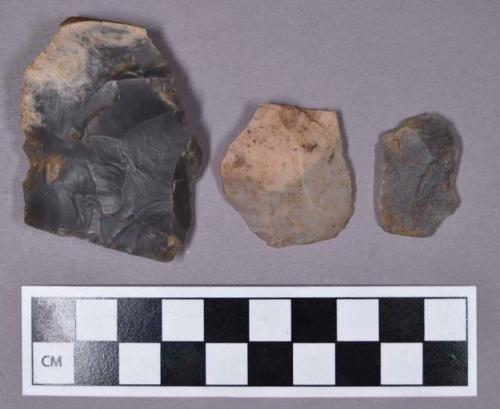 Chipped stone, two flakes and one unfinished biface fragment, includes chert