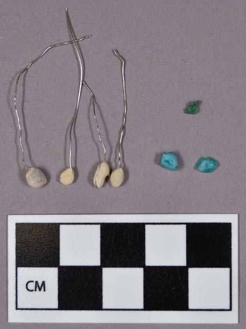 Mineral, two fragments of apatite, four round white mineral objects, and one copper fragment