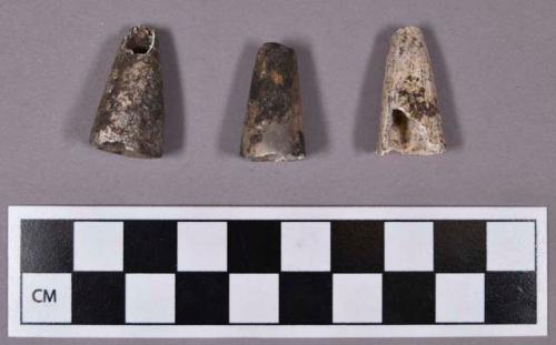 Organic, faunal remains, utilized bone, cone-shaped, perforated, hollowed, and calcined