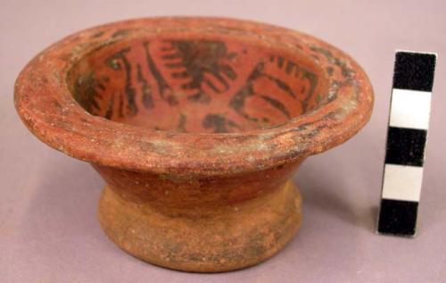 Small pottery bowl - black on red on inside surface