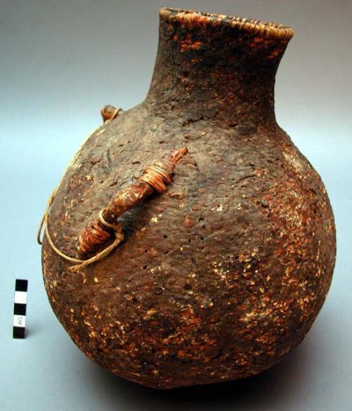 Medium-sized basketry water jug, twined. Made of bear grass.