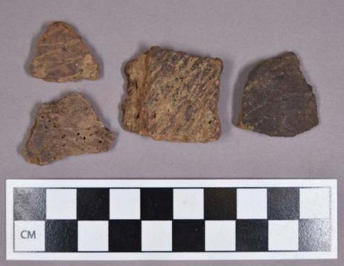 Ceramic, earthenware body sherds, incised, cord-impressed, and punctate decorated