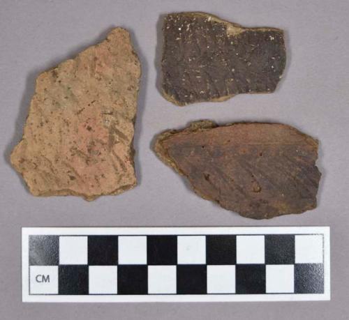 Ceramic, earthenware body and rim sherds, includes punctate and incised decoration; one sherd was sampled for thin section