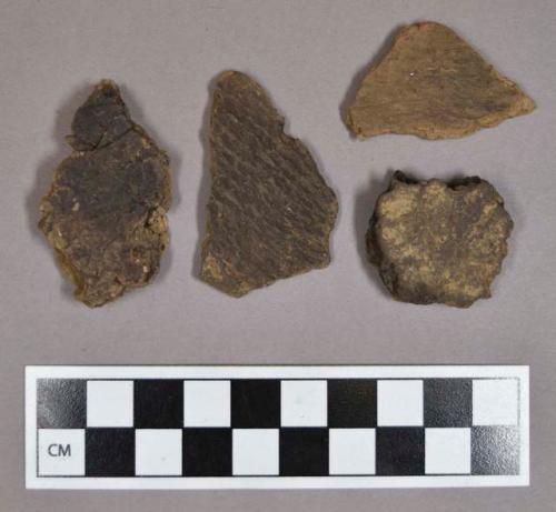 Ceramic, earthenware body sherds, cord-impressed; some sherds crossmend; five sampled for thin sections; found with tubular copper bead (2000.1.131)