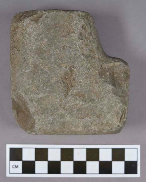 Ground stone, L-shaped object, one end partially perforated; possible pipe preform