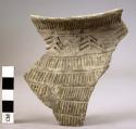 Potsherd of corded amphora with stamped ornament from a megalith