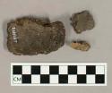 Ceramic, earthenware base sherd, and body sherds with impressed surface decoration or missing surfaces