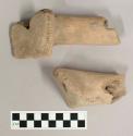 2 earthenware vessel fragments; possibly hollow handle or foot fragments