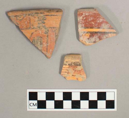 Earthenware rim sherds, curved towards interior, polychrome exterior, red on orange interior