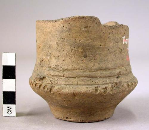 Ancient vessel; vase ornamented with incised lines