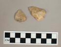 2 small triangular quartzite flakes