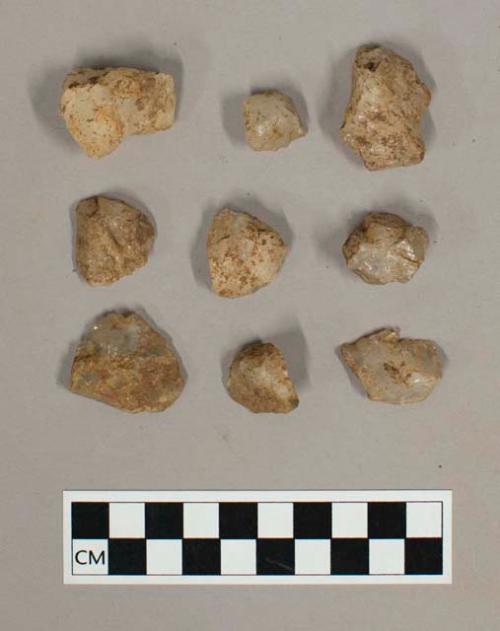 9 miscellaneous quartzite trimming flakes & crude cores