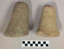 Ground stone pestles, flared at one end