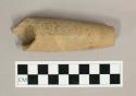 Ground stone pipe, straight, incised design, broken at both ends