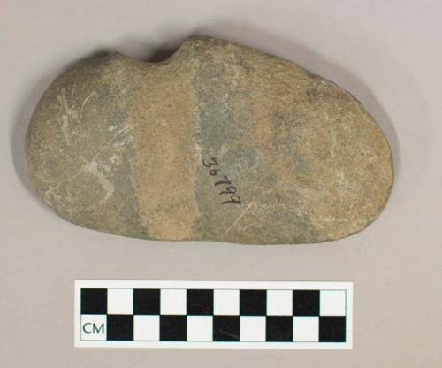 Ground stone axe, grooved, flat on one side