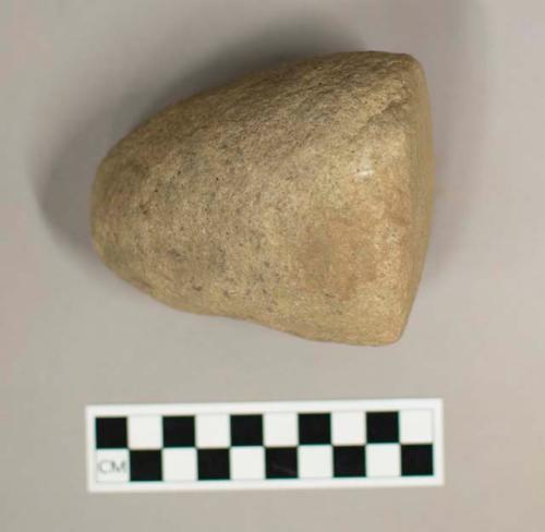 Ground stone pestle, bell shape